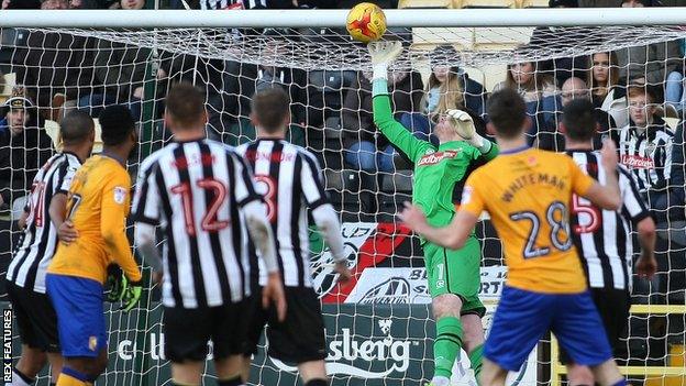 Notts County goalkeeper Adam Collin makes a save against Mansfield Town