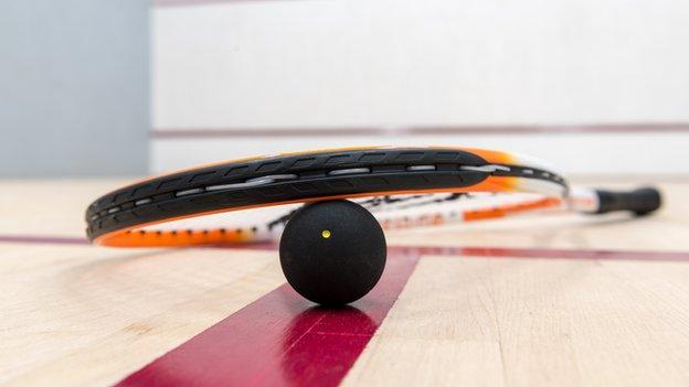 Squash ball on court