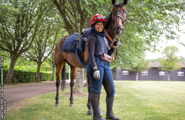 Khadijah Mellah standing holding horse Haverland