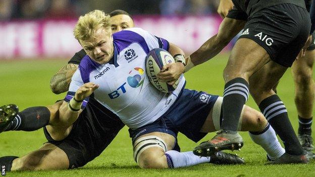 Luke Hamilton carries the ball for Scotland against New Zealand