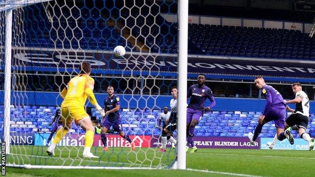 Matty Godden of Coventry sends a header just wide against Tranmere