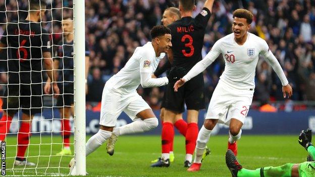 Jesse Lingard (left) scores