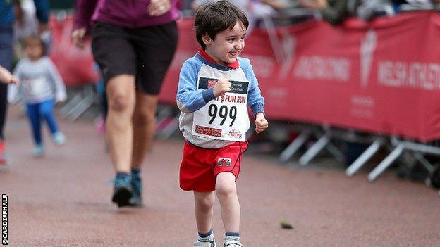 A child enjoying the Cardiff Half Marathon fun run on Saturday