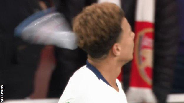 Dele Alli being struck by the plastic bottle