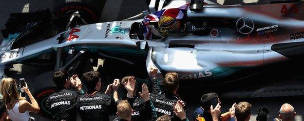 Lewis Hamilton celebrates with his team