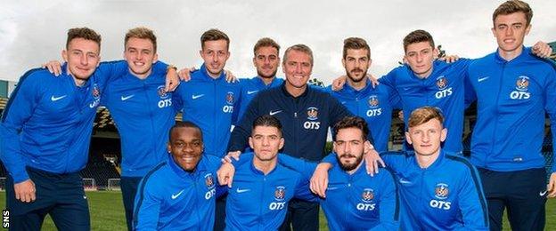 Lee Clark poses with his 11 new players