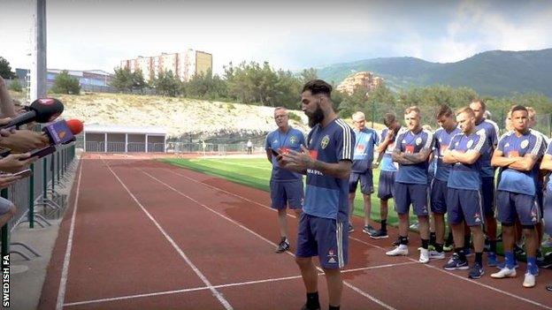 Sweden's Jimmy Durmaz reads statement