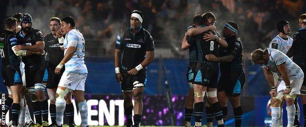 Glasgow players celebrate a famous win at the full-time whistle