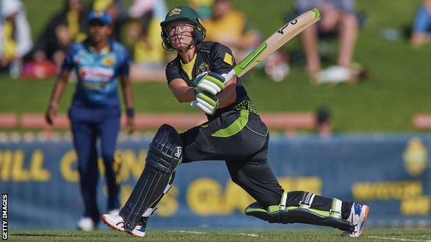 Australia opener Alyssa Healy hits a sweep shot in the third women's T20 against Sri Lanka