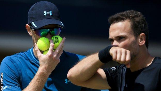 Jamie Murray speaks to partner Bruno Soares in their quarter-final win at Queen's