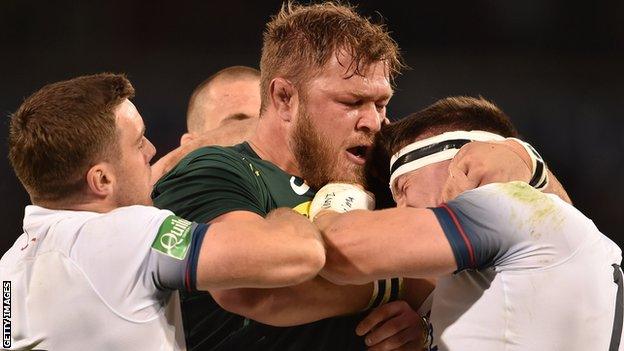 Duane Vermeulen gets to grips with Tom Curry as George Ford tries to intervene