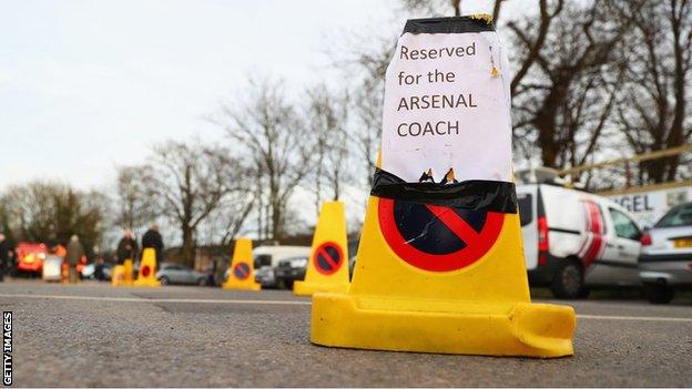 Sutton United reserve a space for Arsenal's team bus