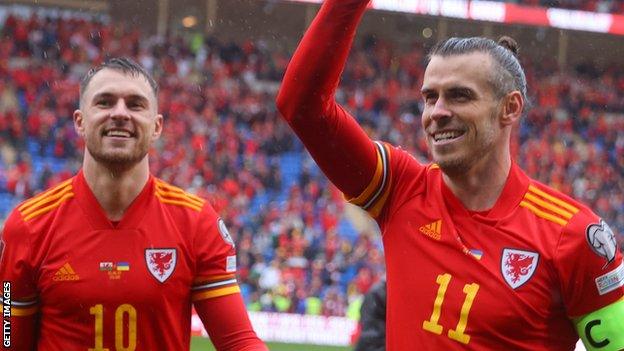 Aaron Ramsey and Gareth Bale celebrate qualifying for the World Cup