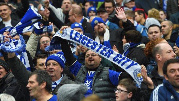 Leicester City fans watch their team at Manchester City