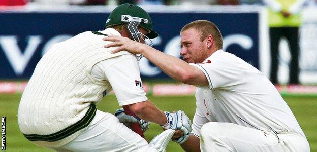 Andrew Flintoff embraces Brett Lee