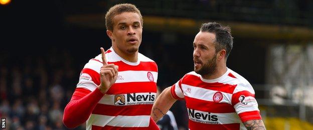 Carlton Morris (left) celebrates a goal for Hamilton