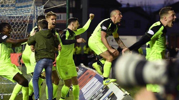 Scott Brown and team-mates celebrate his winner with Celtic fans