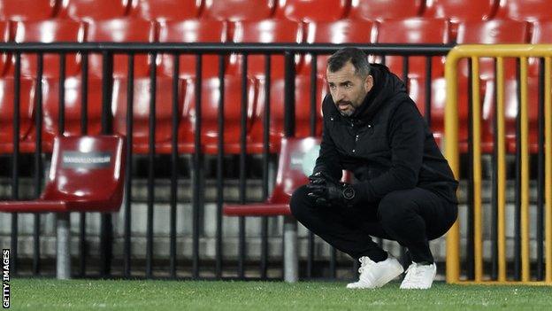 Diego Martinez crouches down during Granada's Europa League last 32 tie against Napoli