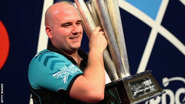 Rob Cross with the PDC World Darts Championship trophy