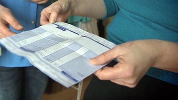 Worker looking at payslip