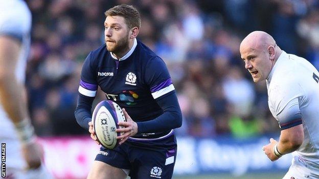 Finn Russell runs with the ball for Scotland against England