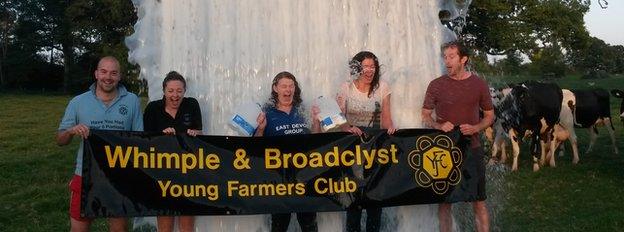 Milk Bucket Challenge: Picture of milk being poured over some young farmers