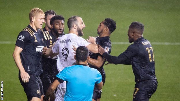 Gonzalo Higuain is involved with a confrontation with Philadelphia players after his penalty miss