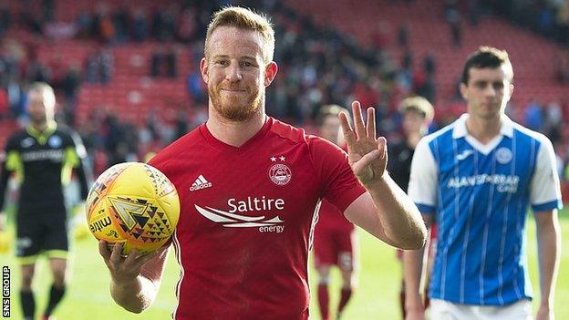 Adam Rooney celebrates his hat-trick at full-time