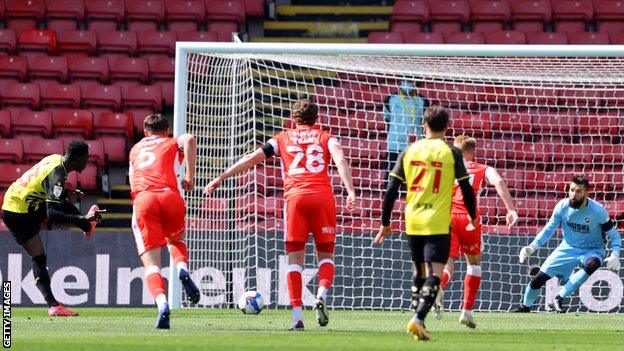 Ismaila Sarr (far left) scores a penalty for Watford