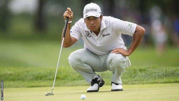 Japanese golfer Hideki Matsuyama lines up a putt at the BMW Championship