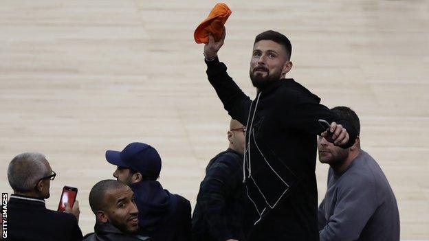 Chelsea's Olivier Giroud throws a shirt into the crowd