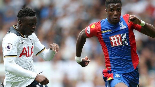 Wilfried Zaha takes on Tottenham's Victor Wanyama