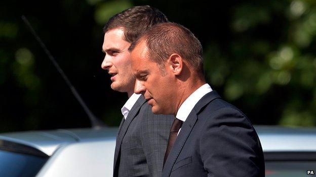 Footballer Adam Johnson (left) arrives at Durham Crown Court