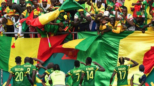 Mali celebrate Ibrahima Kone's penalty against The Gambia