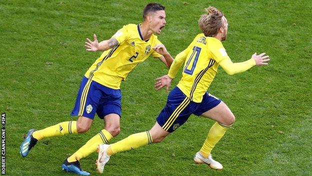 Sweden's Mikael Lustig and Emil Forsberg celebrate the winning goal against Switzerland