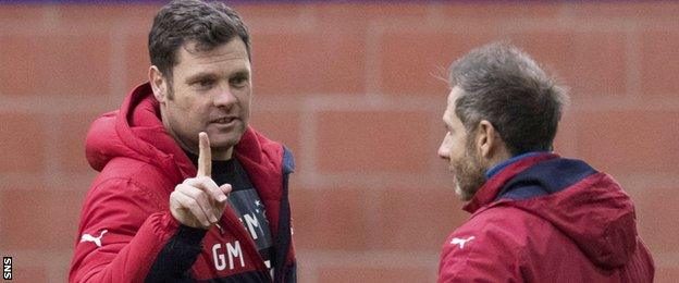 Rangers caretaker manager Graeme Murty (left) makes a point in training