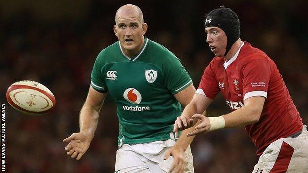 Adam beard makes a pass during Wales' 2019 Six Nations win against Ireland