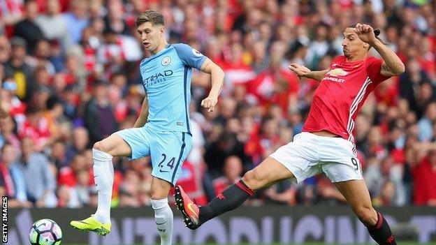 Manchester City centre-back John Stones (left) in action against Manchester United striker Zlatan Ibrahimovic