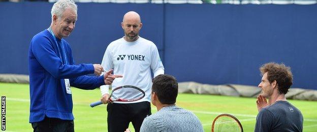 John McEnroe speaking with Andy Murray and Milos Raonic