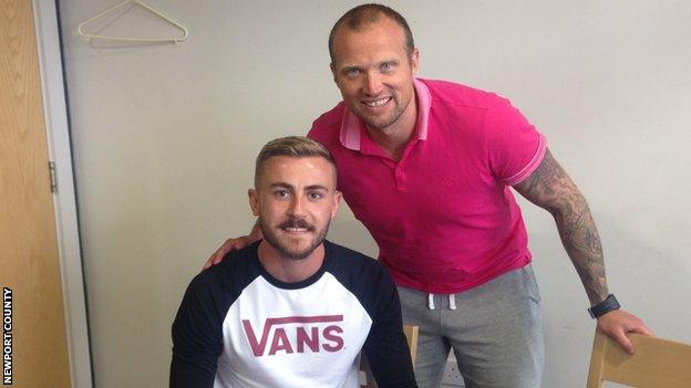 Dan Butler with Newport County manager Warren Feeney