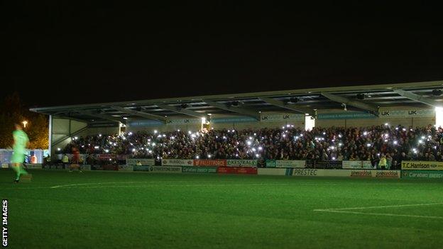 Fans shine mobile phones at Pirelli Stadium