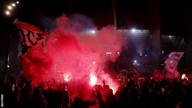 PSG fans celebrate outside stadium