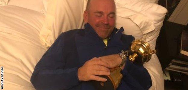 Thomas Bjorn cuddles the Ryder Cup trophy