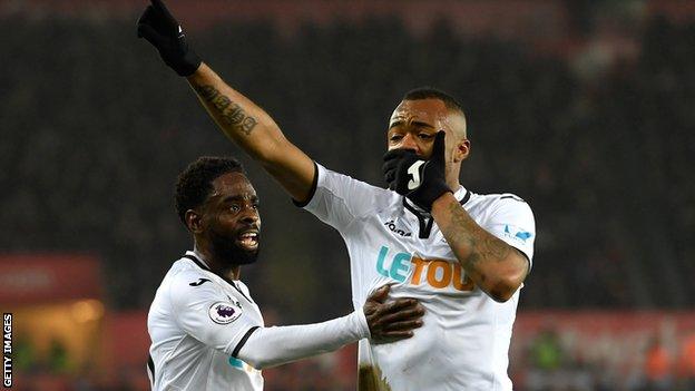 Jordan Ayew celebrates scoring the equaliser for Swansea.