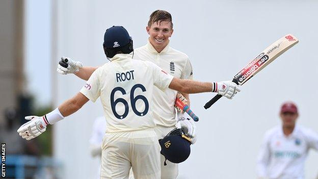 England batters Zak Crawley (right) and Joe Root (left) embrace