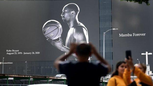 A billboard salutes the life of Bryant as fans gather in Los Angeles