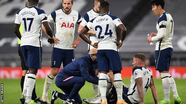 Tottenham defender Toby Alderweireld receives treatment on the pitch