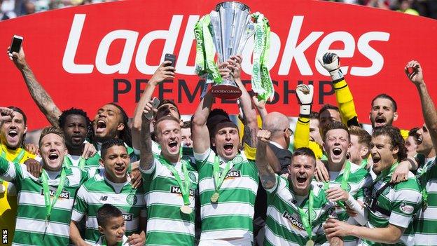 Celtic captain Scott Brown lifts the Premiership trophy