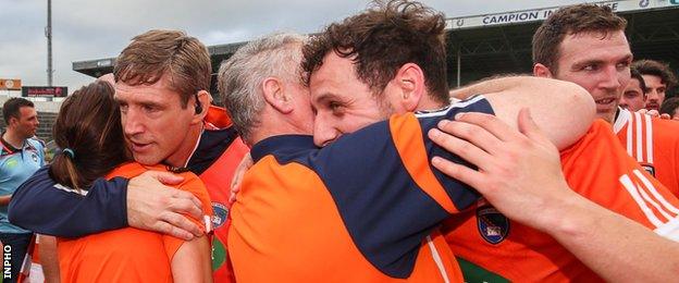 Kieran McGeeney and Jamie Clarke celebrate after Armagh's win in Thurles