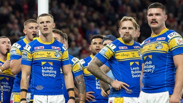 Leeds Rhinos players look dejected after their 2022 Grand Final defeat by St Helens